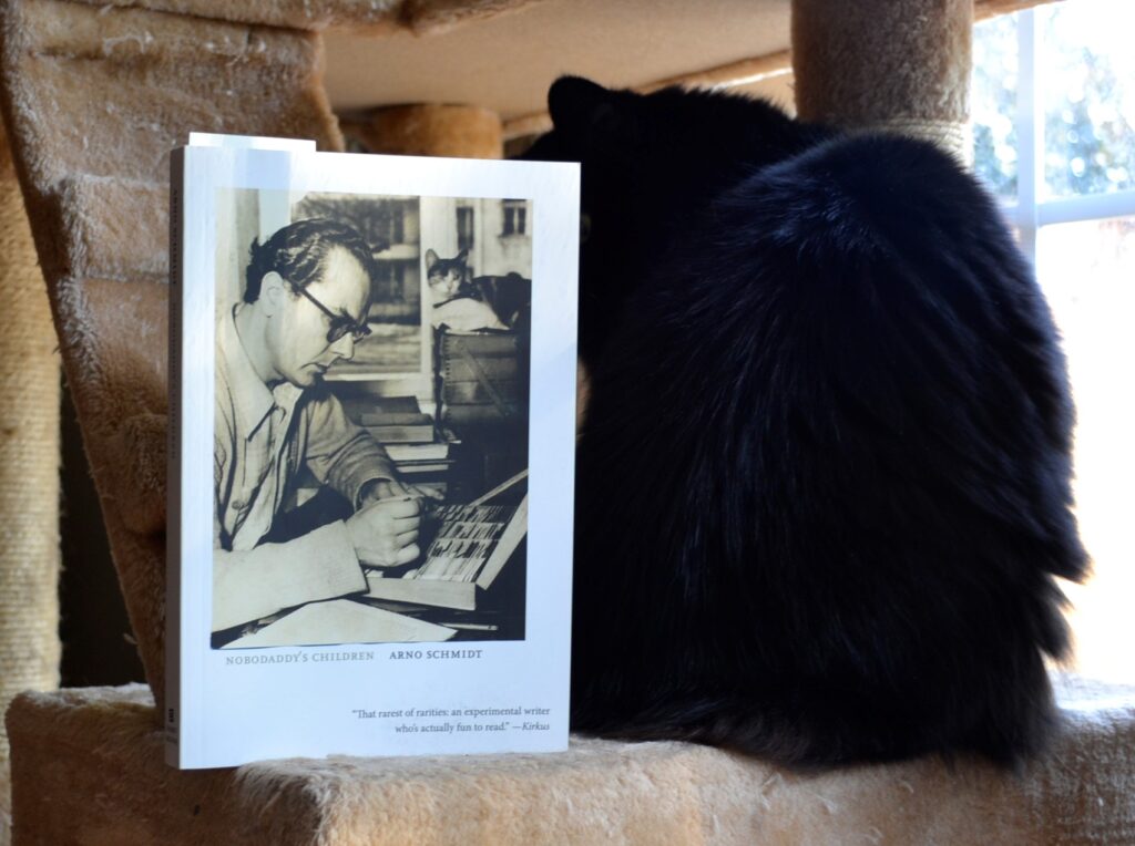 A black cat sits beside Nobodaddy's Children.