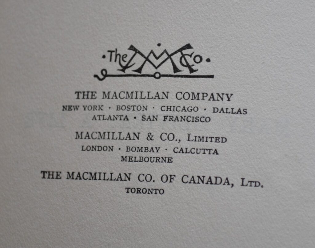 A stylized art deco logo used by the Macmilla company in 1919.