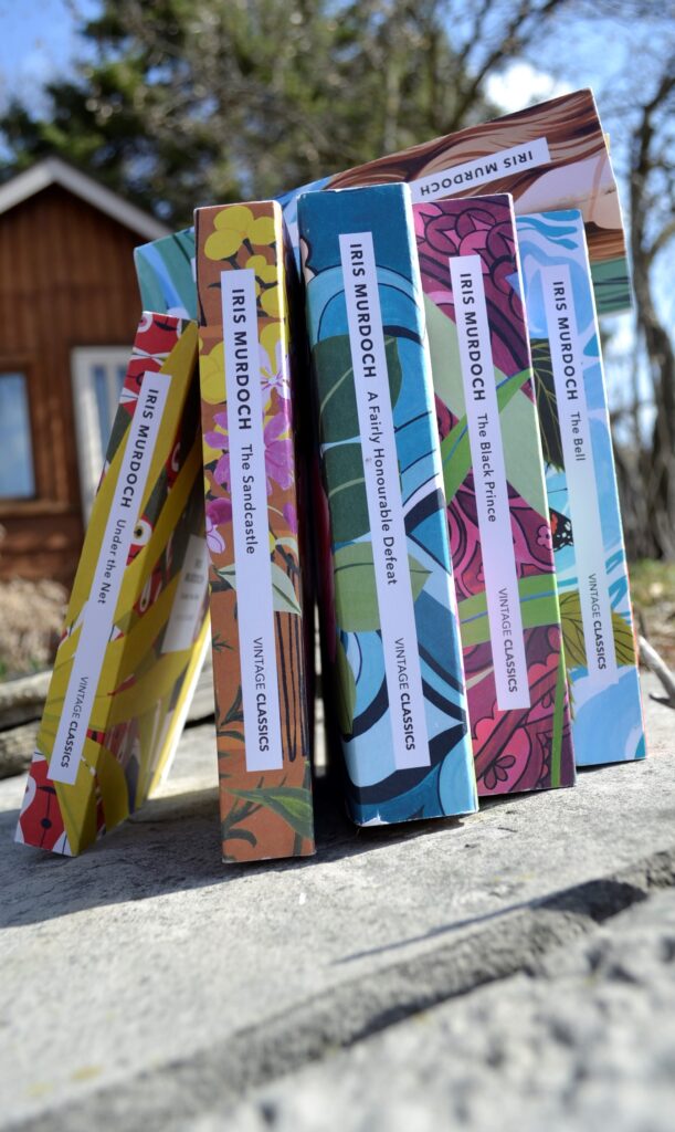 The brightly coloured spines of the Vintage Classics Murdoch series.