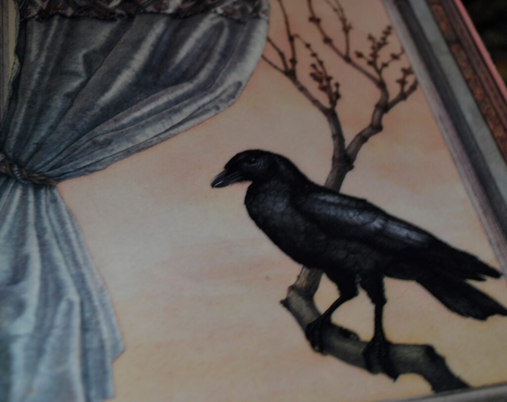 A closeup of the illustrated crow perched on a budding branch.