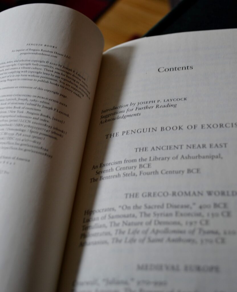A book opens to a contents page that begins with 'The Ancient Near East'.