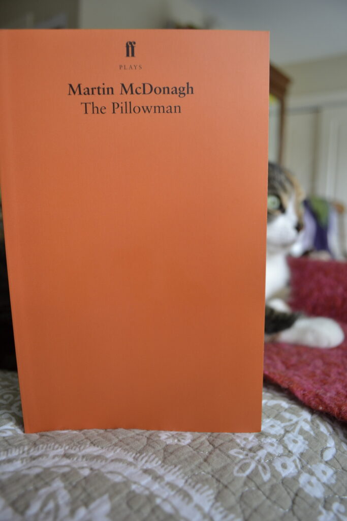 The Pillowman by Martin McDonagh is printed in a plain orange volume.