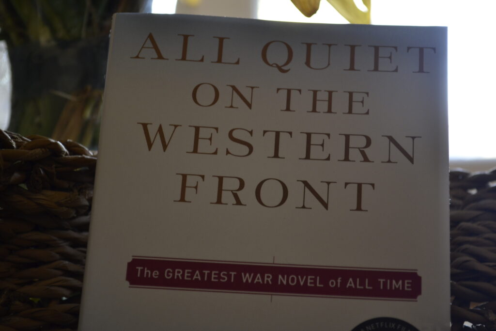A closeup of All Quiet on the Western Front, subtitled 'The GREATEST WAR NOVEL of ALL TIME'.