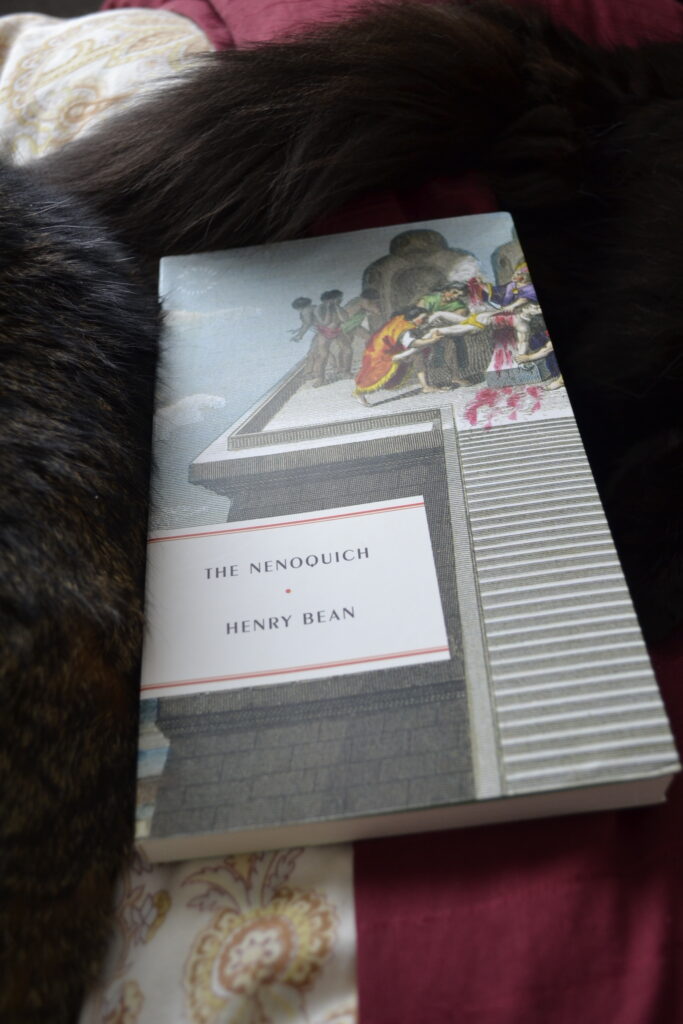 Two cat tails frame The Nenoquich by Henry Bean. The book's cover depicts a bloody Aztec human sacrifice.