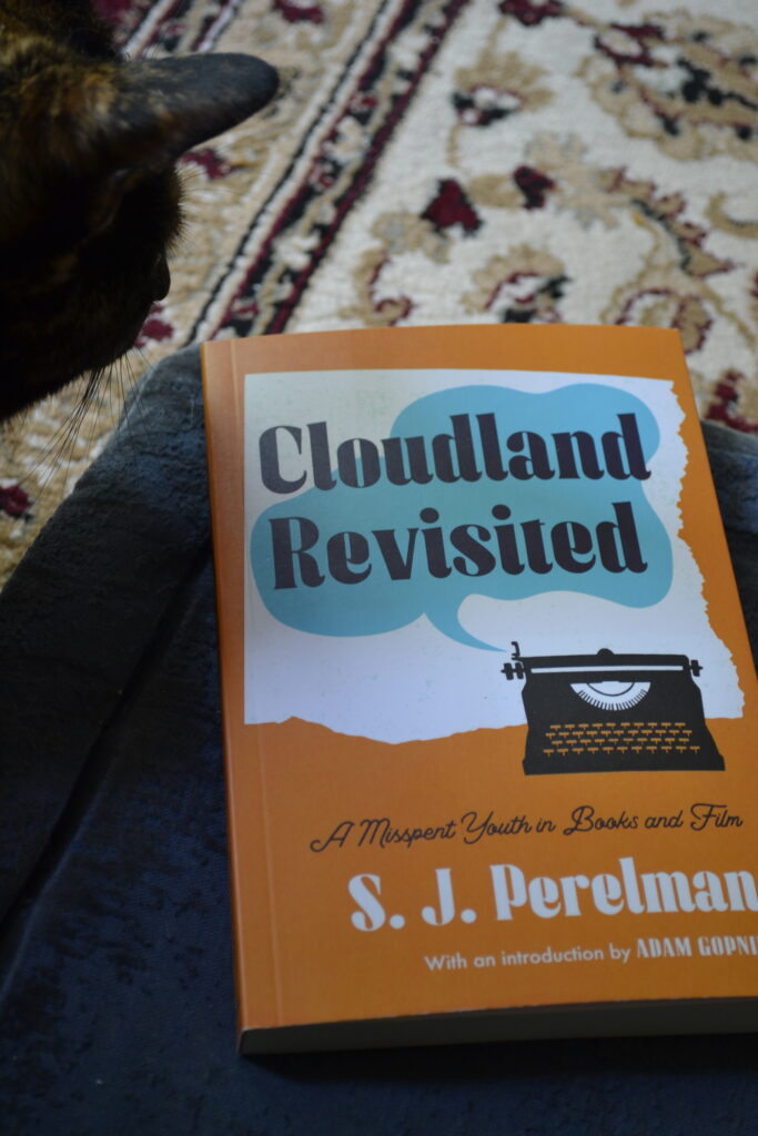 Cloudland Revisited has the title set in a blue cloud on an orange cover.