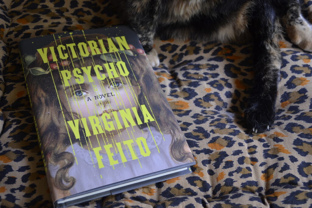 On the cover of Victorian Psycho, a painting of a young girl in a lace collar looks outwards from behind bright yellow dripping font.