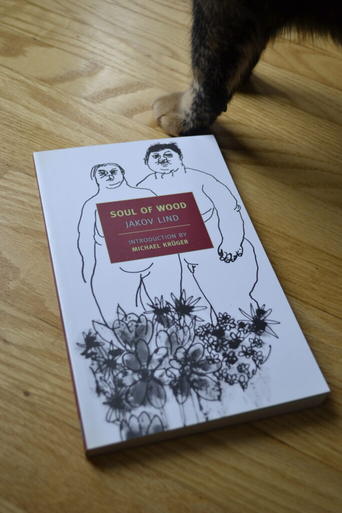 This edition of Soul of Wood by Jakov Lind features a monochrome cover with a simple drawing of a naked woman and man with flowers by their feet.