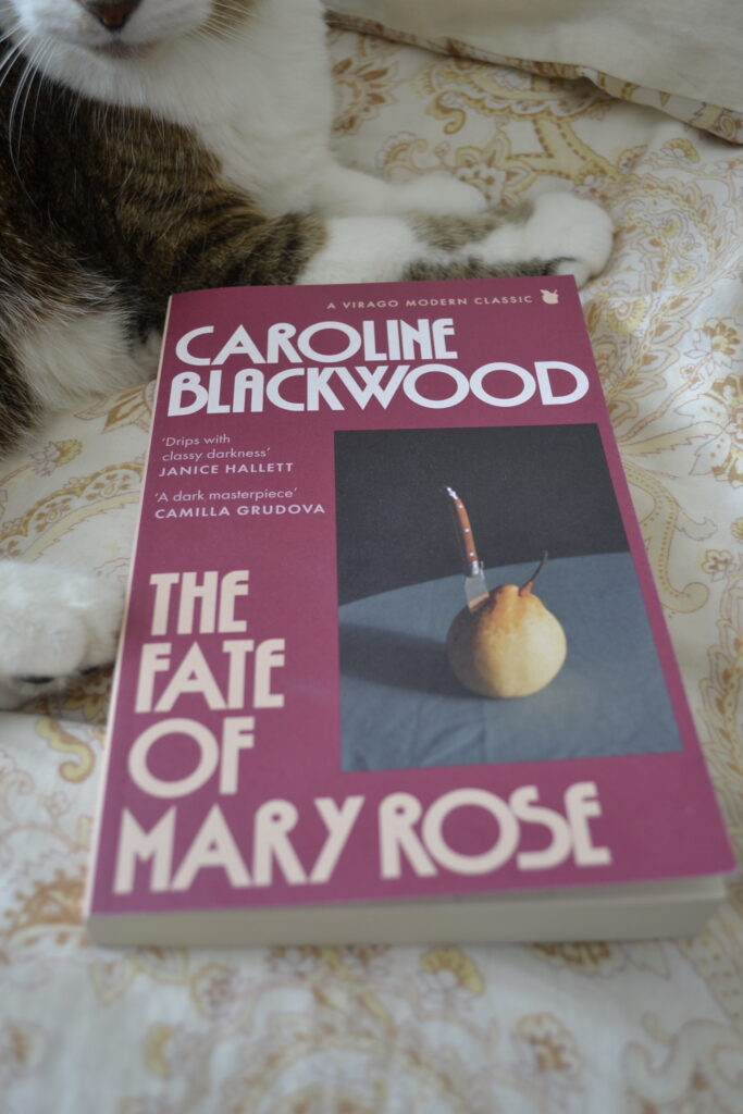 The Fate of Mary Rose by Caroline Blackwood is a dark pink paperback with a picture of a pear stabbed by a knife on the cover.