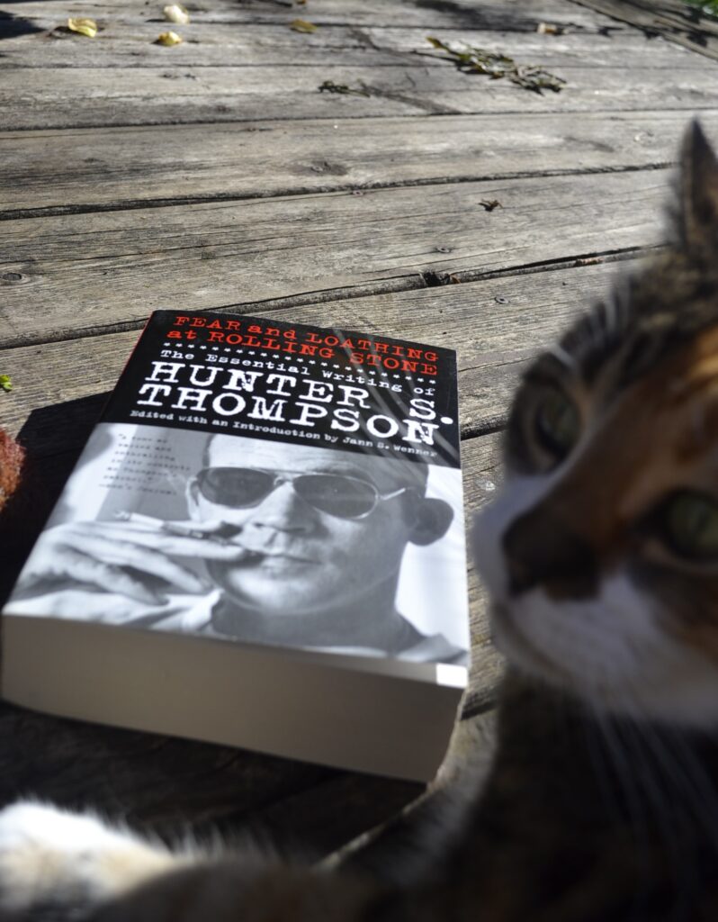Fear and Loathing at Rolling Stone: The Essential writing of Hunter S Thompson is a thick paperback book with a picture of Thompson smoking a cigarette on the cover.